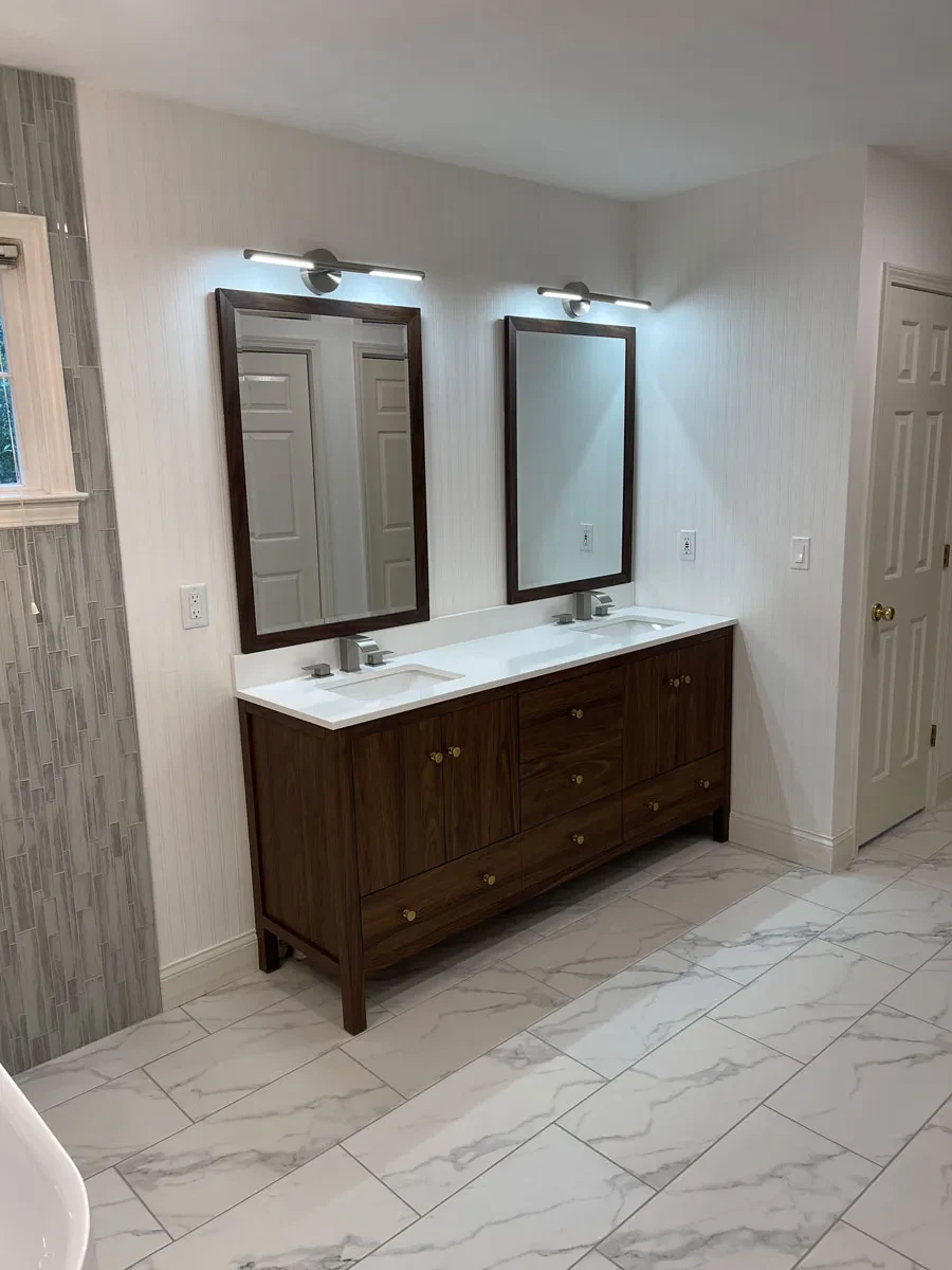 Elegant bathroom with dual vanities and mirrored cabinets